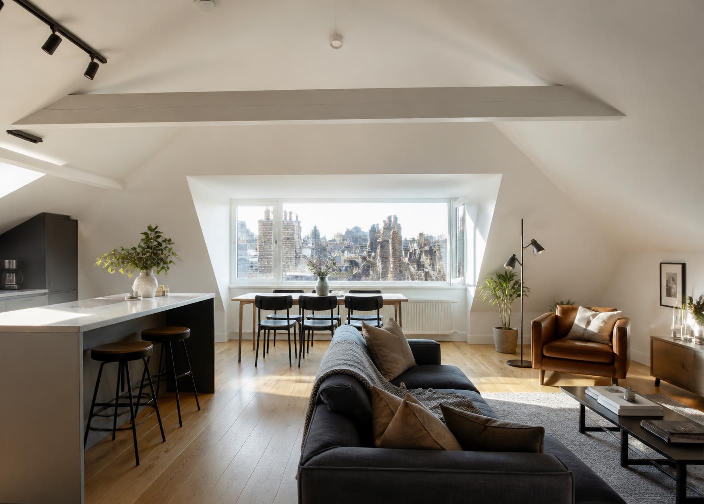 Modern loft conversion living space with dormer window overlooking London rooftops